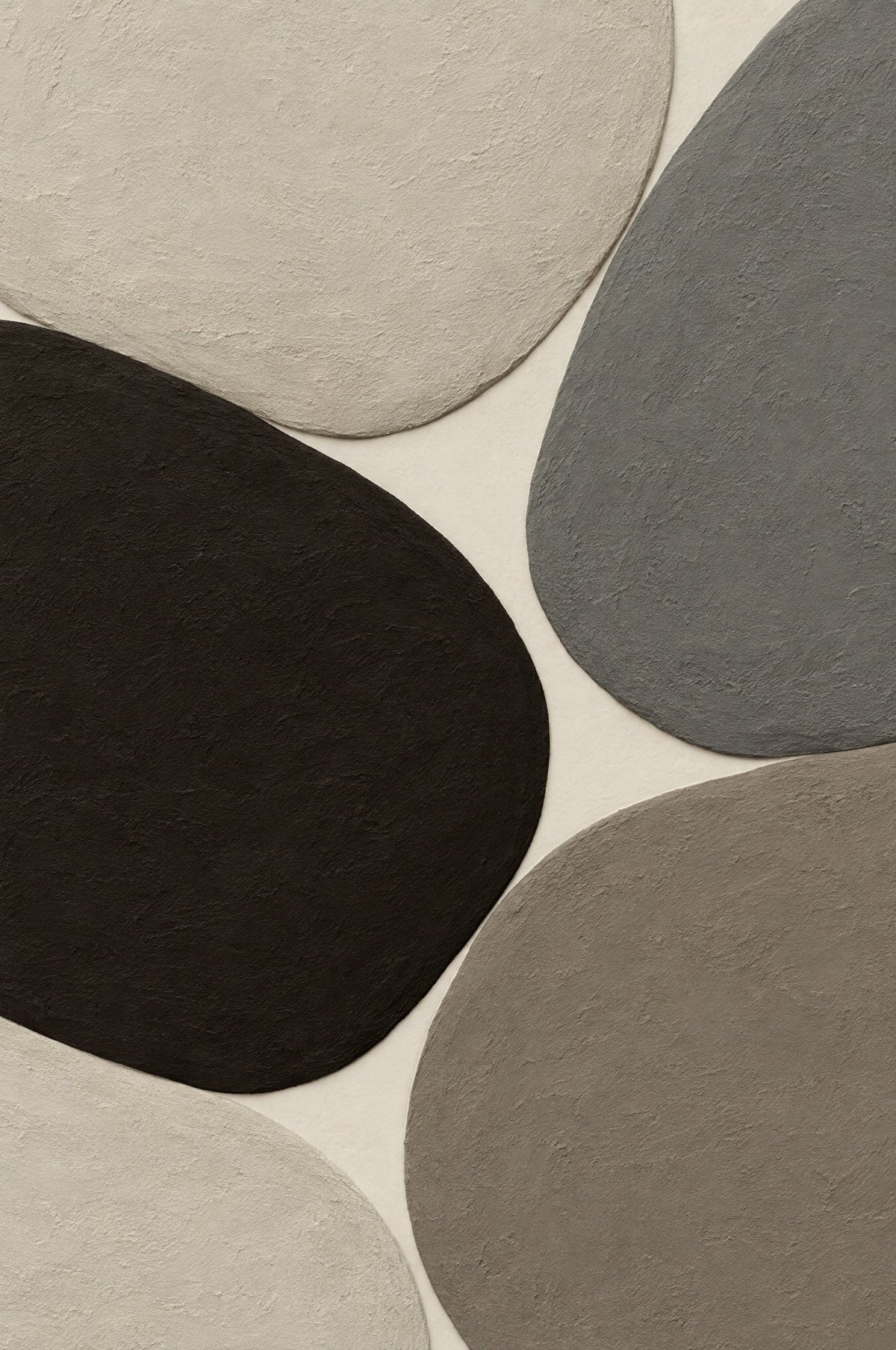 Rounded stone shapes in relief in espresso brown, mineral grey, taupe and bone on cream